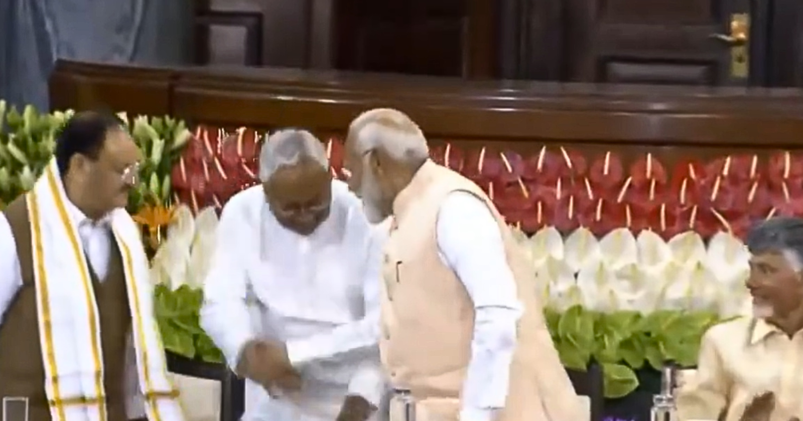 WATCH Nitish Kumar Tries To Touch PM Modis Feet Heres